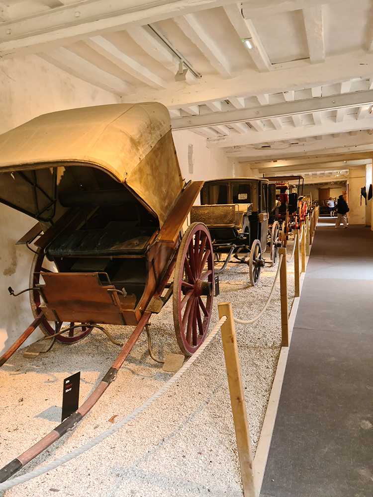 Interior view of the stable at Château de Chenonceau, featuring rustic architecture and vintage charm.