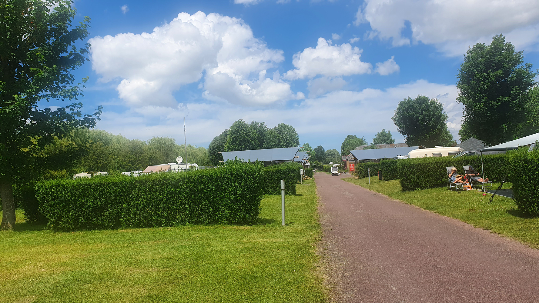 A scenic pathway leading to Mont Saint-Michel, winding through picturesque landscapes towards the historic abbey.