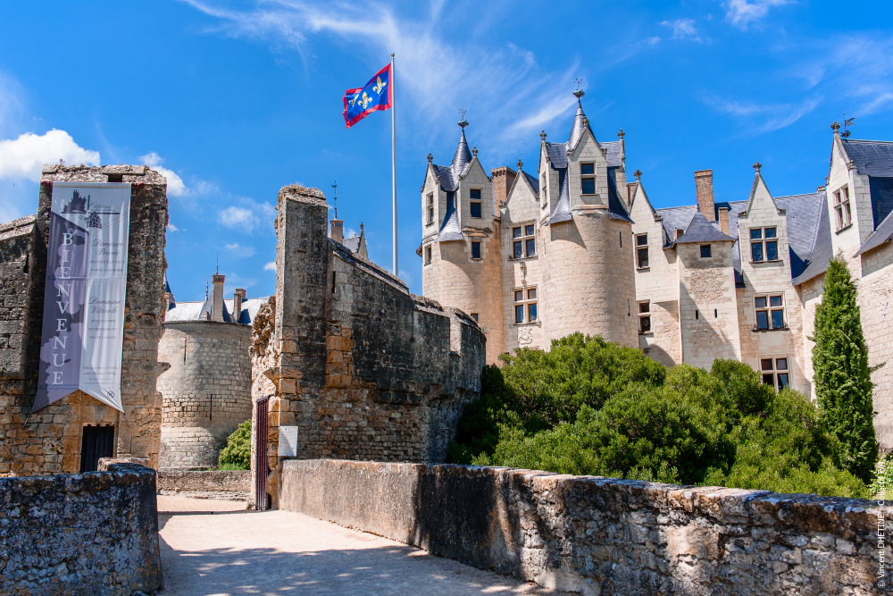 Front entrance view of the Château de Montreuil-Bellay, showcasing its majestic medieval architecture and picturesque setting.