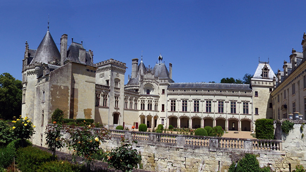 Front view of the majestic Château du Brézé, showcasing its impressive Renaissance architecture and fortified walls.