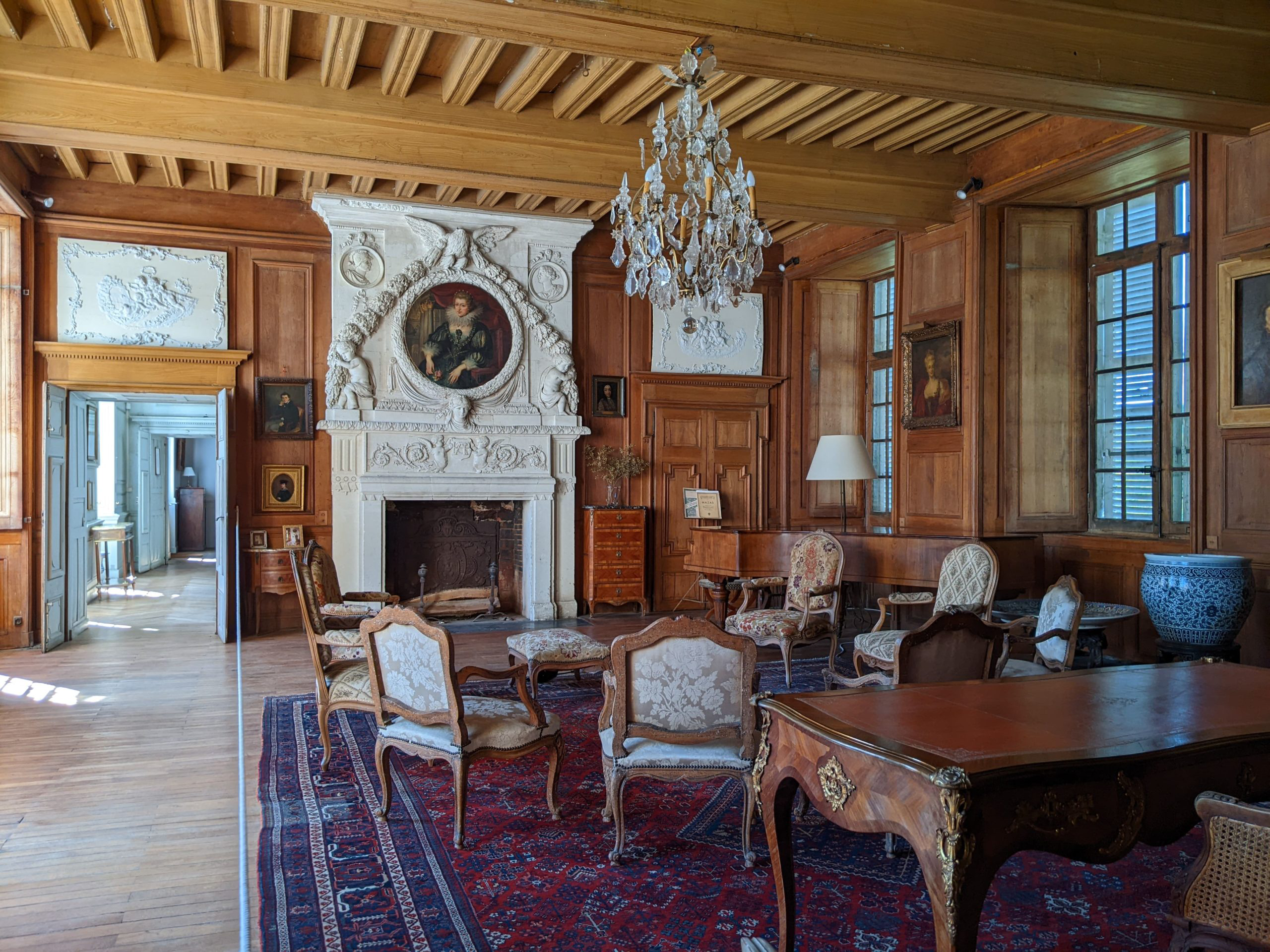 Interior view of the elegant rooms at Château du Gué-Péan, showcasing its historic architecture and exquisite furnishings