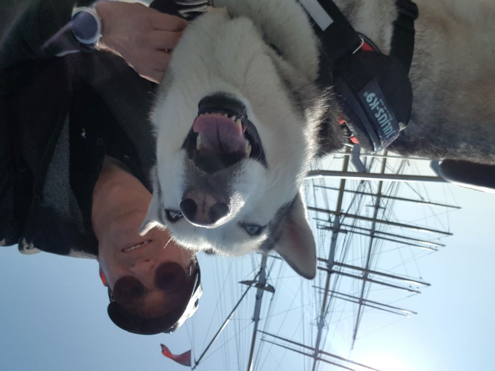 Selfie of owner and dog digging by Tall Ship Glenlee