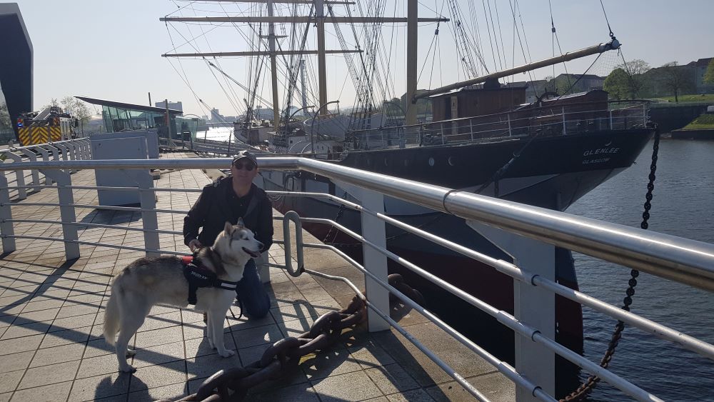 Selfie of owner and dog digging by Tall Ship Glenlee