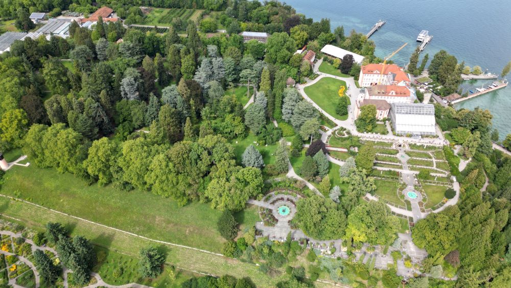 Drone footage of Mainau Island, showcasing its lush gardens, pathways, and scenic surroundings.