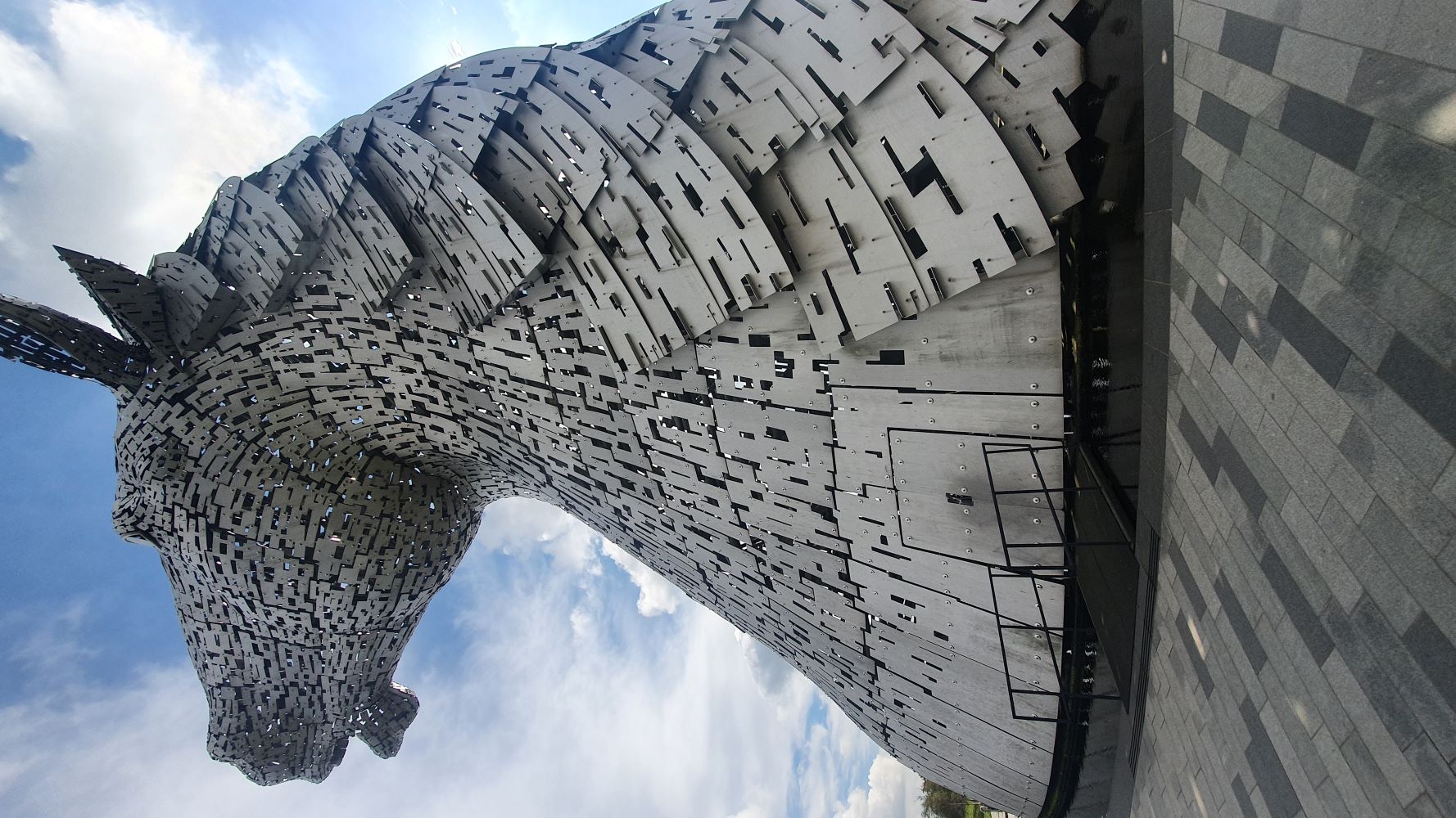 Giant Kelpie sculptures in Falkirk, Scotland, against a cloudy sky.