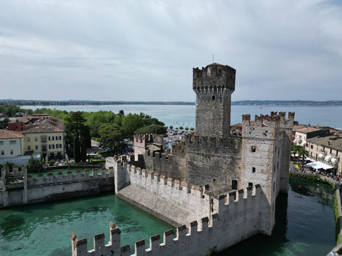 Castello Scaligero di Sirmione, a historic waterfront castle with striking architecture in a scenic and picturesque setting.