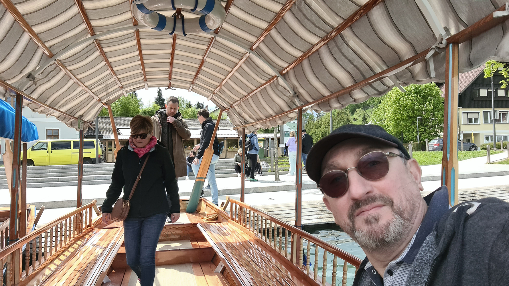 Pletna boats on Lake Bled, with traditional wooden design and the serene lake in the background.