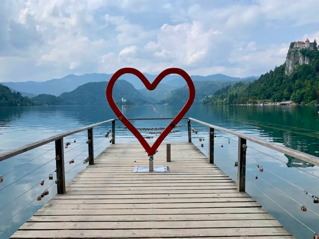 Heart-shaped symbol created at Lake Bled, with the iconic church on Bled Island in the background.