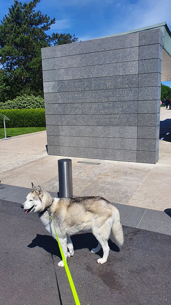 A plaque inscribed with names at the Omaha Beach Memorial, honoring the brave individuals who fought and perished during the D-Day landings of World War II.