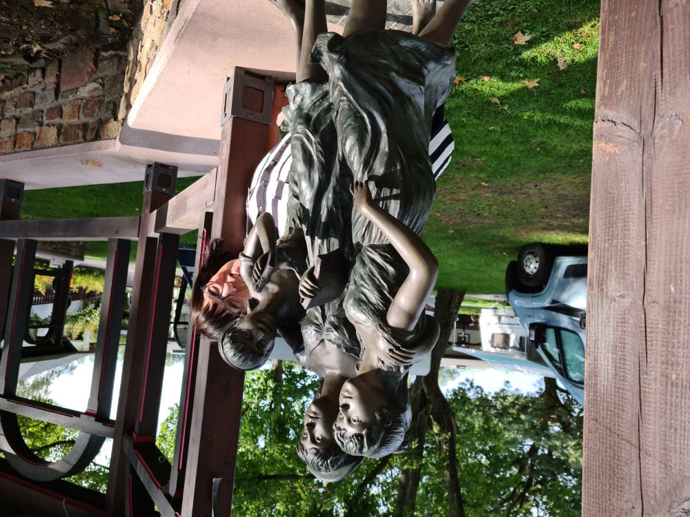 Sculpture at Campingplatz am Rhein, artistically popping out against the scenic riverside backdrop.