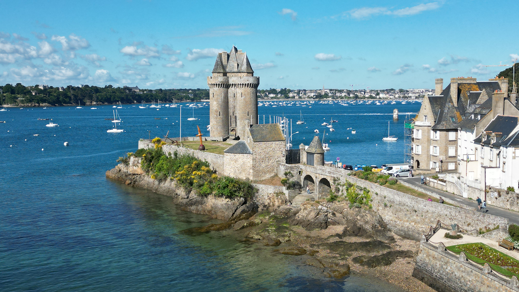 A captivating view of the approaching Tour Solidor de Saint-Servan, standing proudly against the backdrop of the serene coastline.