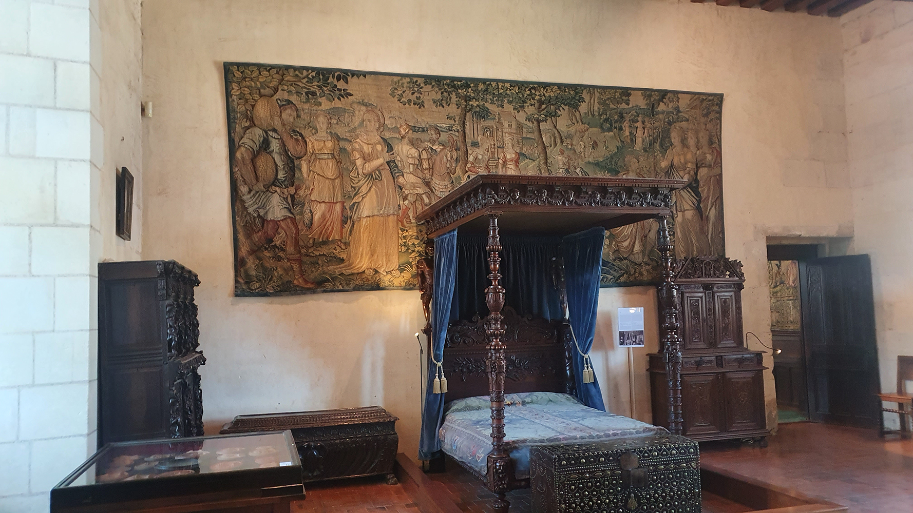 An elegant bed inside the Château de Chaumont, reflecting the historical grandeur and luxury of the estate.