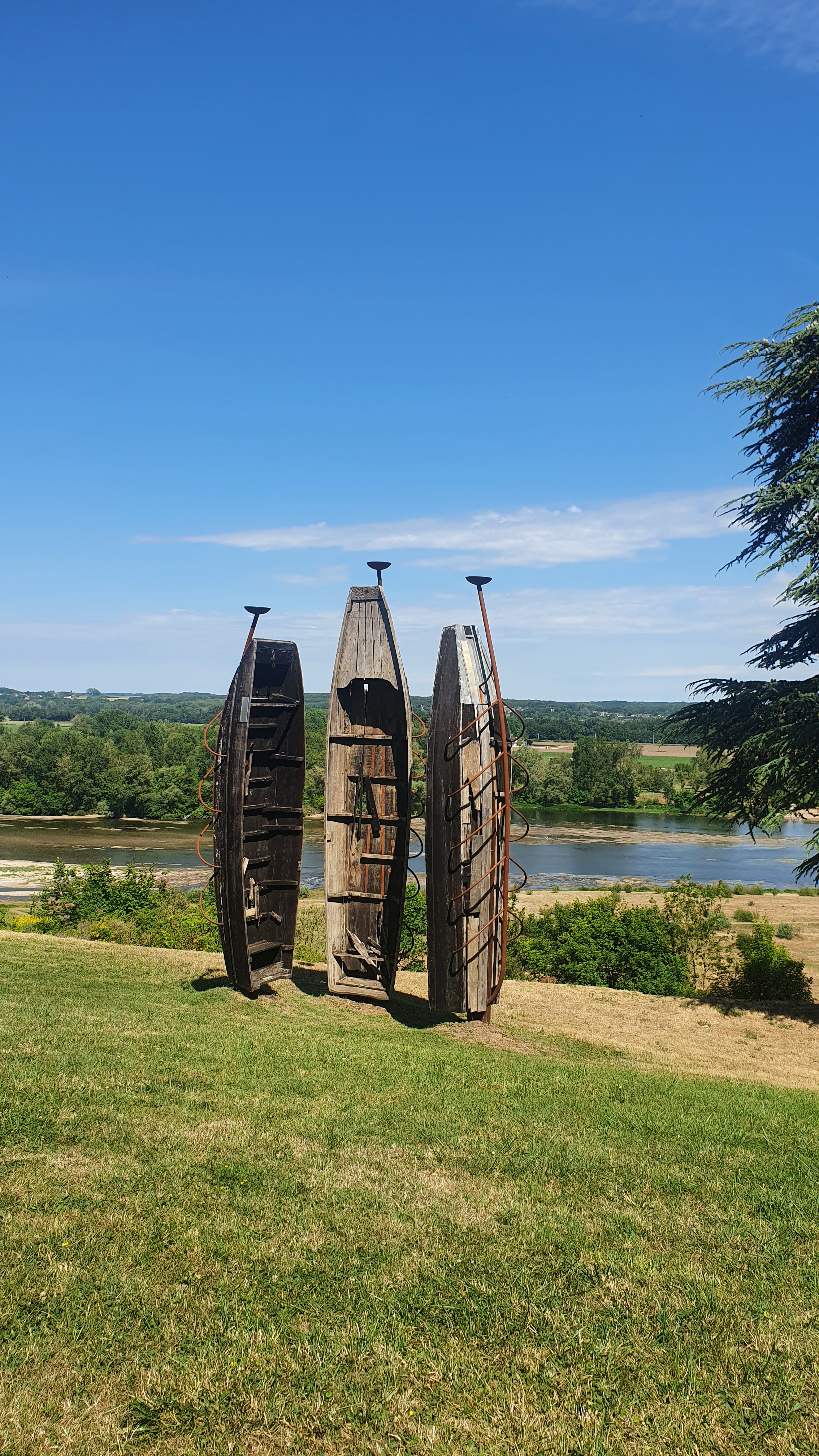 A captivating boat sculpture in the Château de Chaumont garden, adding artistic charm to the serene landscape.