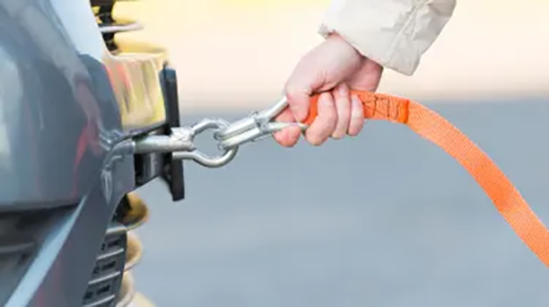 Fiat Ducato stuck in the mud, with a tow vehicle carefully pulling it out using a tow strap to prevent damage Tow Point