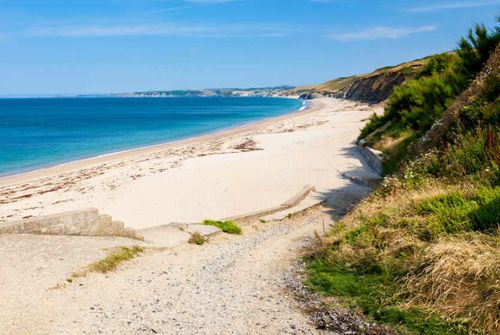 Discover Porthleven Beach in Cornwall. Enjoy golden sands, clear waters, and scenic coastal views perfect for relaxation and adventure.